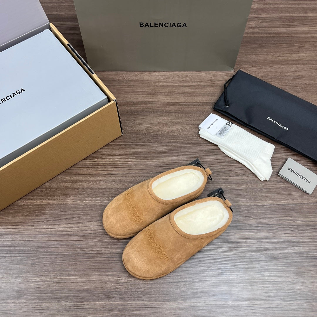 Tan suede sandals with black lace-like drawstrings and padded lining