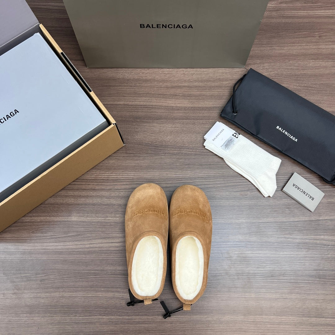 Tan suede sandals, front view showing rounded toe and light interior