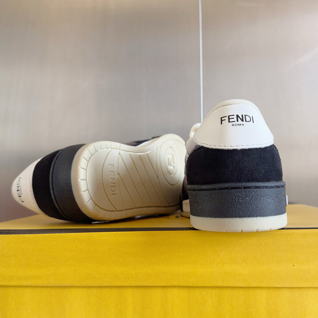 Back view low-top sneakers: white sole and heel with black upper panel, FENDI branding