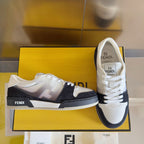Low-top sneakers in box, white leather uppers with black heel and side stripes, lace-up