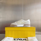 Fendi unisex sneakers on box, white and beige leather lace-up with FENDI logo.