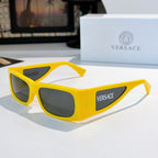 Versace sunglasses with bright yellow frame and dark lenses, side Versace logo.