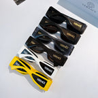 Set of Versace sunglasses on display, black and white frames with side logos.
