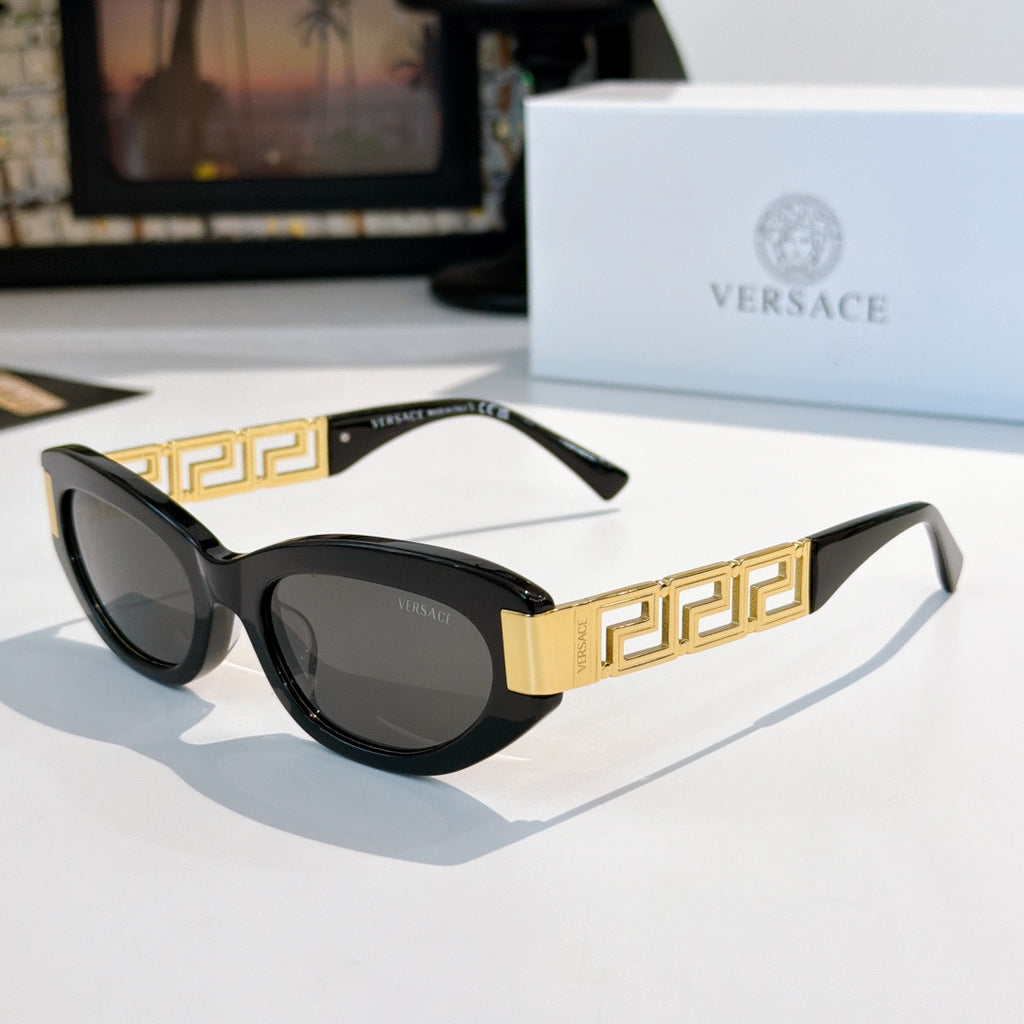 Versace cat-eye sunglasses with black frame, gold Greek key temples, and dark tinted lenses