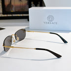 Sunglasses side view with gold metal frame and dark lenses