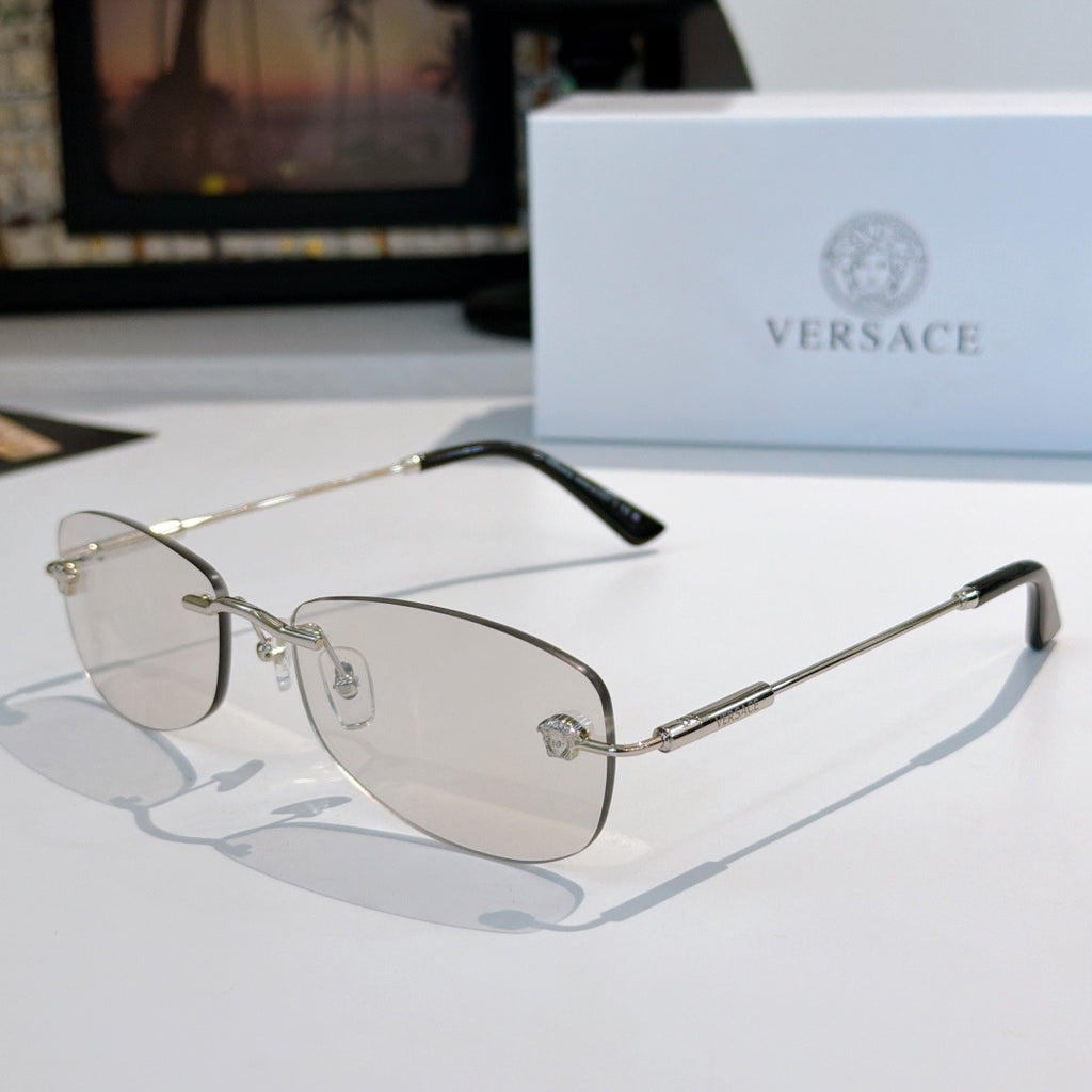 Sunglasses with silver metal frame and clear to lightly tinted lenses