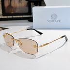 Sunglasses with gold metal frame and light brown lenses