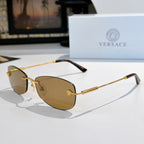 Sunglasses with gold metal frame and brown-tinted lenses