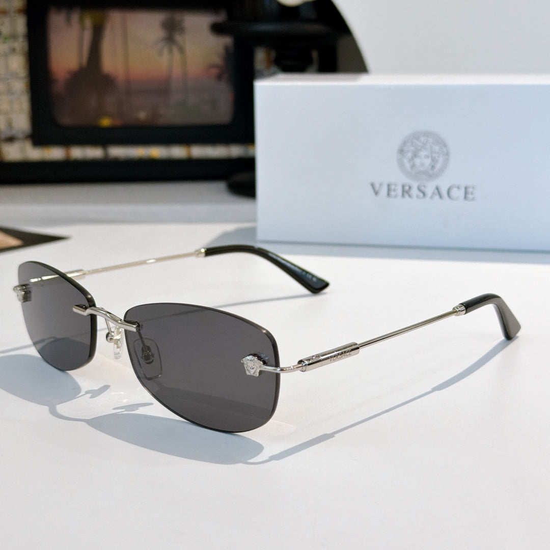 Versace sunglasses with dark lenses, silver metal frame, and black temple tips