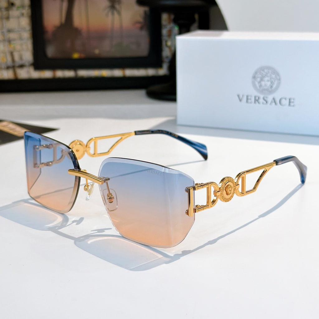 Versace sunglasses with gold-tone frame and light blue tinted lenses