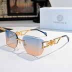 Versace sunglasses with gold-tone frame and light blue tinted lenses