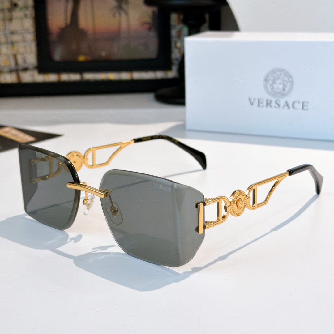 Versace sunglasses with gold-tone frame and dark gray tinted lenses