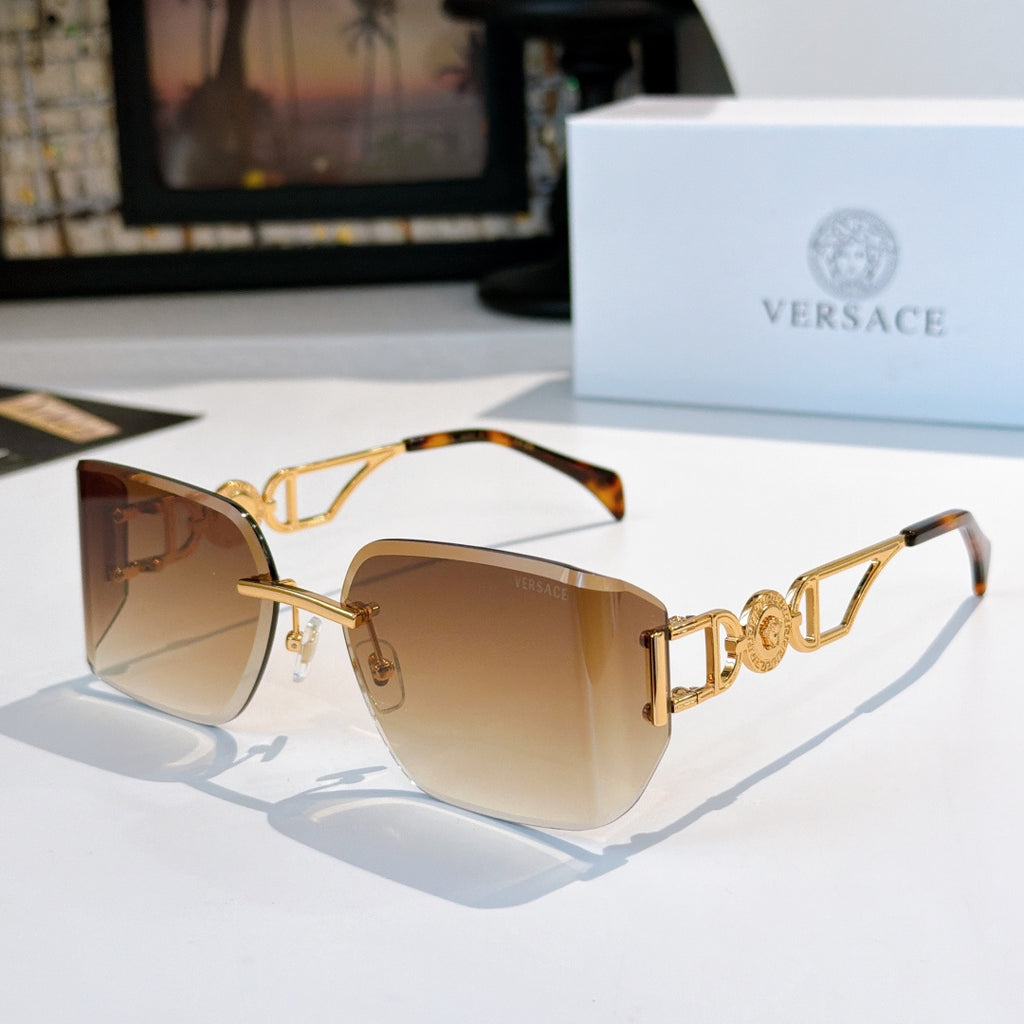 Versace sunglasses with gold-tone frame and amber tinted lenses