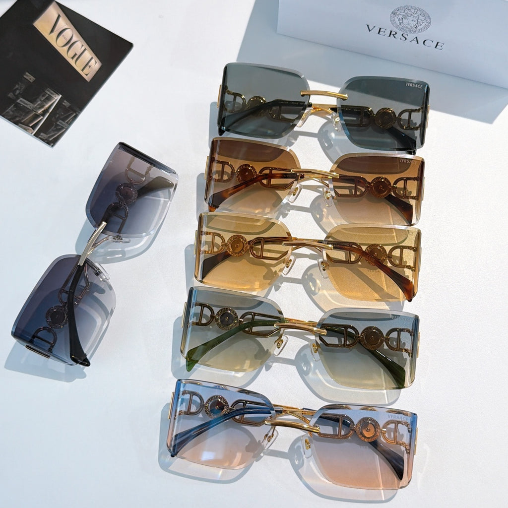 Versace sunglasses display with multiple gold-tone frames and tinted lenses