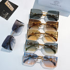 Versace sunglasses display with multiple gold-tone frames and tinted lenses