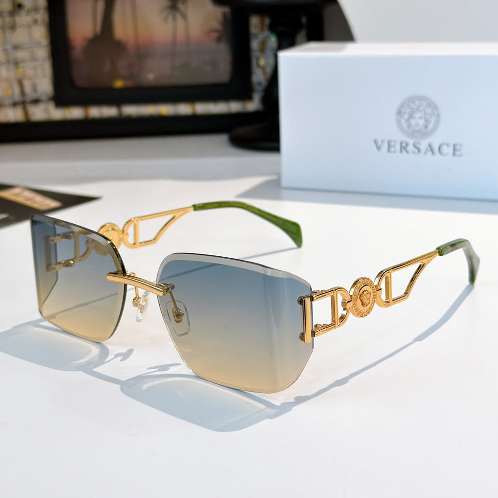 Versace sunglasses with gold-tone frame and pale blue tinted lenses