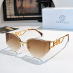 Gold-frame cat-eye sunglasses with tan gradient mirrored lenses.