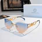 Gold-frame cat-eye sunglasses with blue-tinted mirrored lenses.