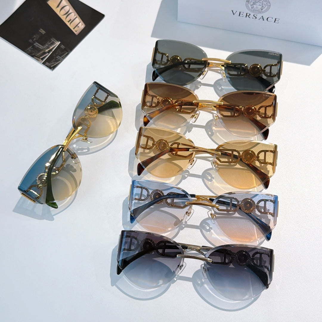 Stack of gold-frame cat-eye sunglasses with mixed tinted mirrored lenses.