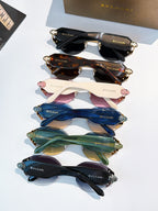 Bvlgari sunglasses set with multiple frame colors, stacked view showing lens tints and gold details