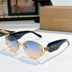 Bvlgari sunglasses with blue gradient lenses, dark blue frame, and gold-tone hinge detail