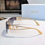 Shield sunglasses with blue-to-violet gradient lenses and gold-tone frame, close angle