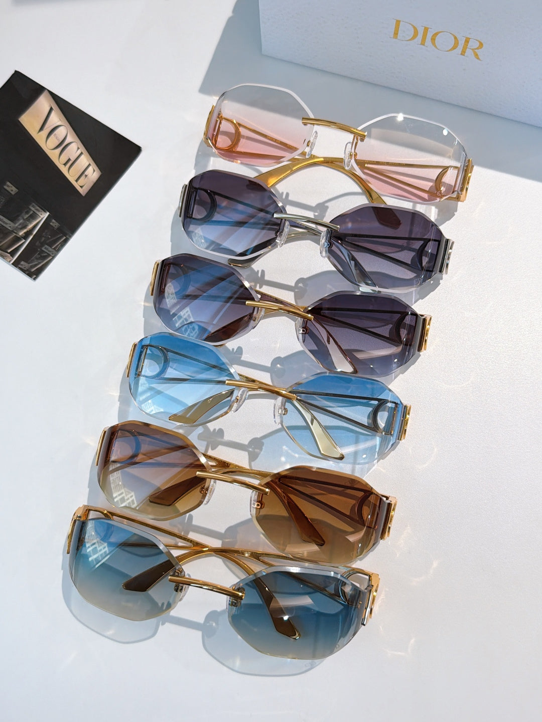Dior sunglasses display set with mixed tinted lenses and gold-tone frames