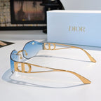 Dior sunglasses with pale blue lenses and gold-tone frames
