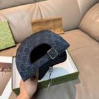 Gucci navy GG monogram cap with front strap and metal buckle, underside view