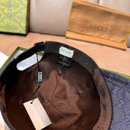 Gucci cap interior with brown lining and hanging tags, navy GG monogram