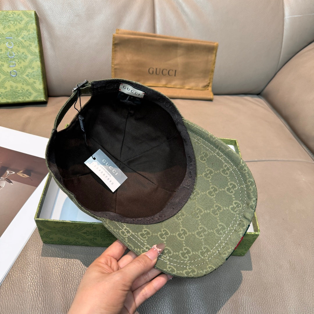 Dark green GG canvas cap with black interior lining and adjustable strap