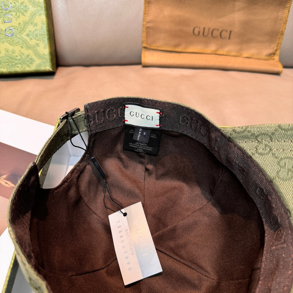 Dark green GG canvas cap interior with adjustable band and hanging size tag