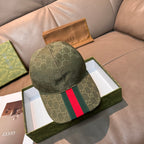 GG canvas cap in dark green with allover logo print and multicolor Web stripe panel