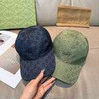 Gucci GG-print cap duo: dark navy and sage green with curved brims