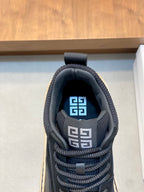 Black sneaker tongue with Greek-letter logo and blue fabric lining