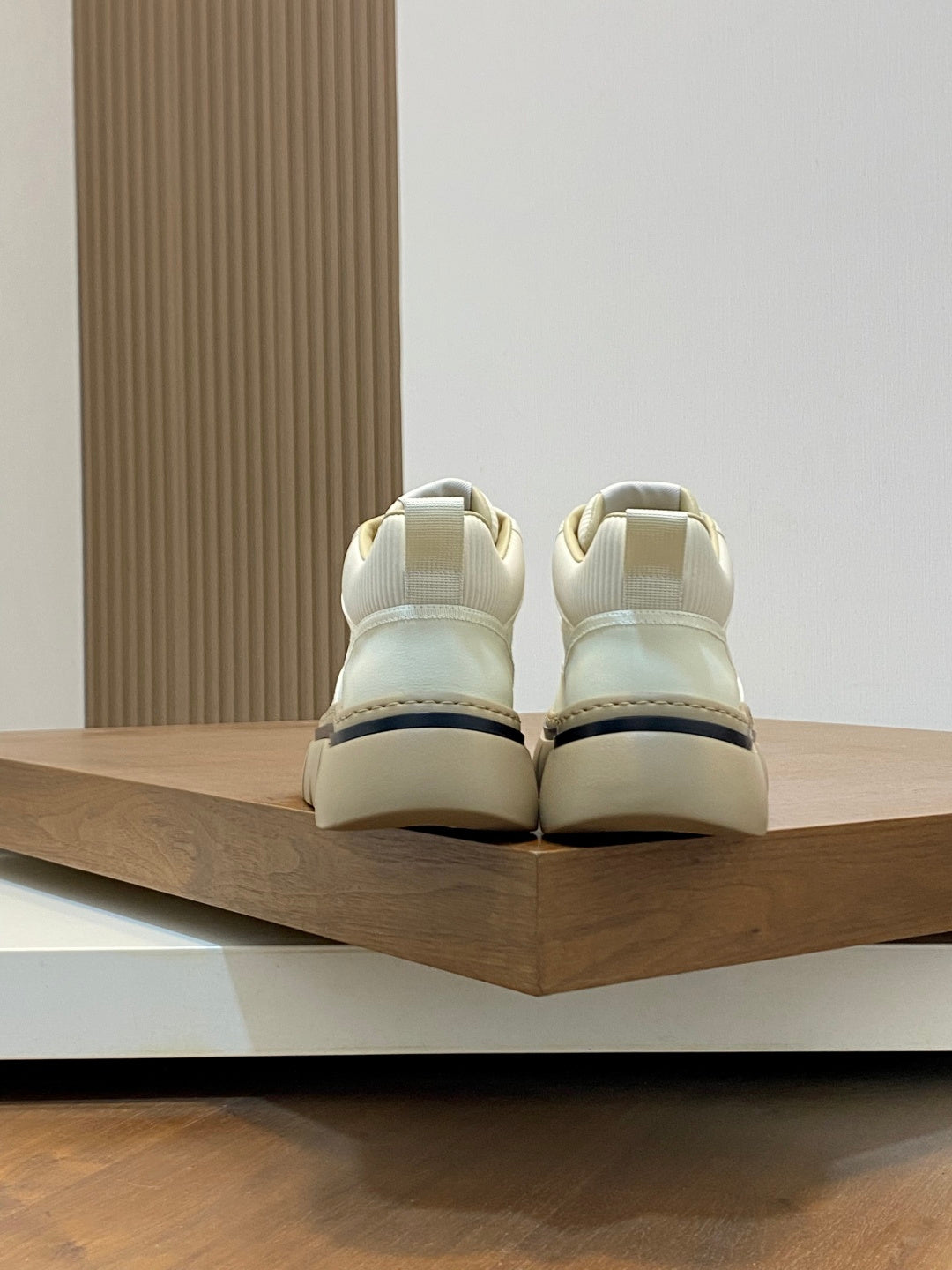 Givenchy white sneakers, heel view with rear pull tab and rubber sole