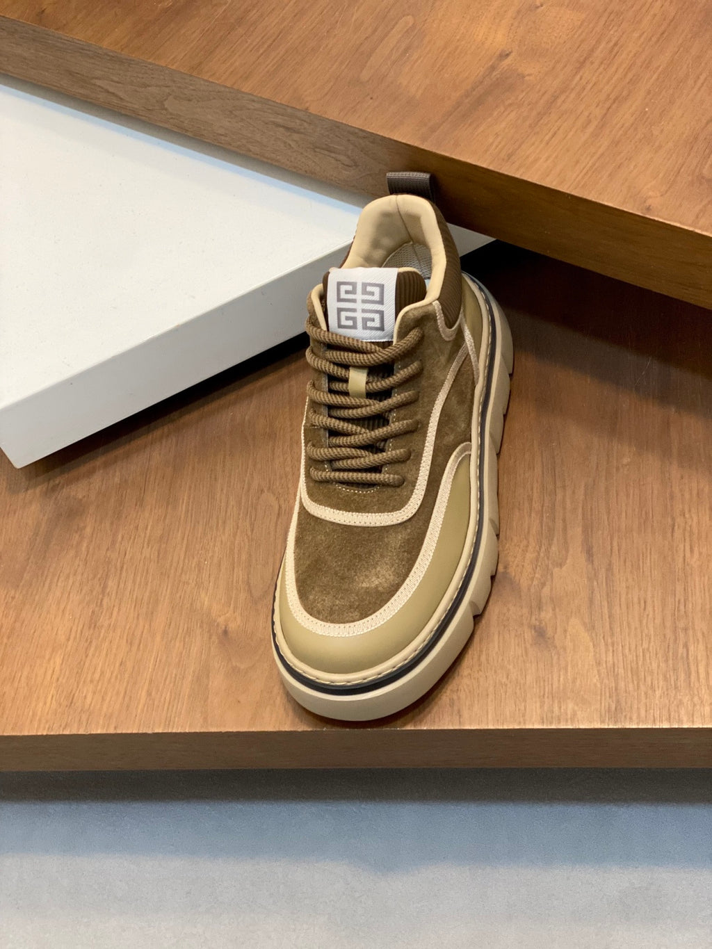 Luxury sneakers, olive suede upper with beige piping, lace-up and padded collar