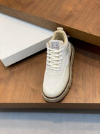 Givenchy white sneaker, side view with Greek key emblem on the tongue