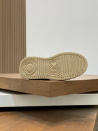 Beige Givenchy sneaker outsole with deep tread and circular traction pattern