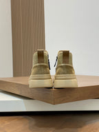 Beige Givenchy high-top sneakers viewed from behind on a display shelf