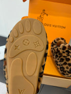 Beige rubber outsole of leopard-print faux-fur slip-on shoe