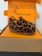 Leopard-print faux-fur slip-on shoe on display, beige sole