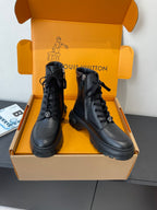 Louis Vuitton unisex black leather lace-up ankle boots, front view with chunky sole