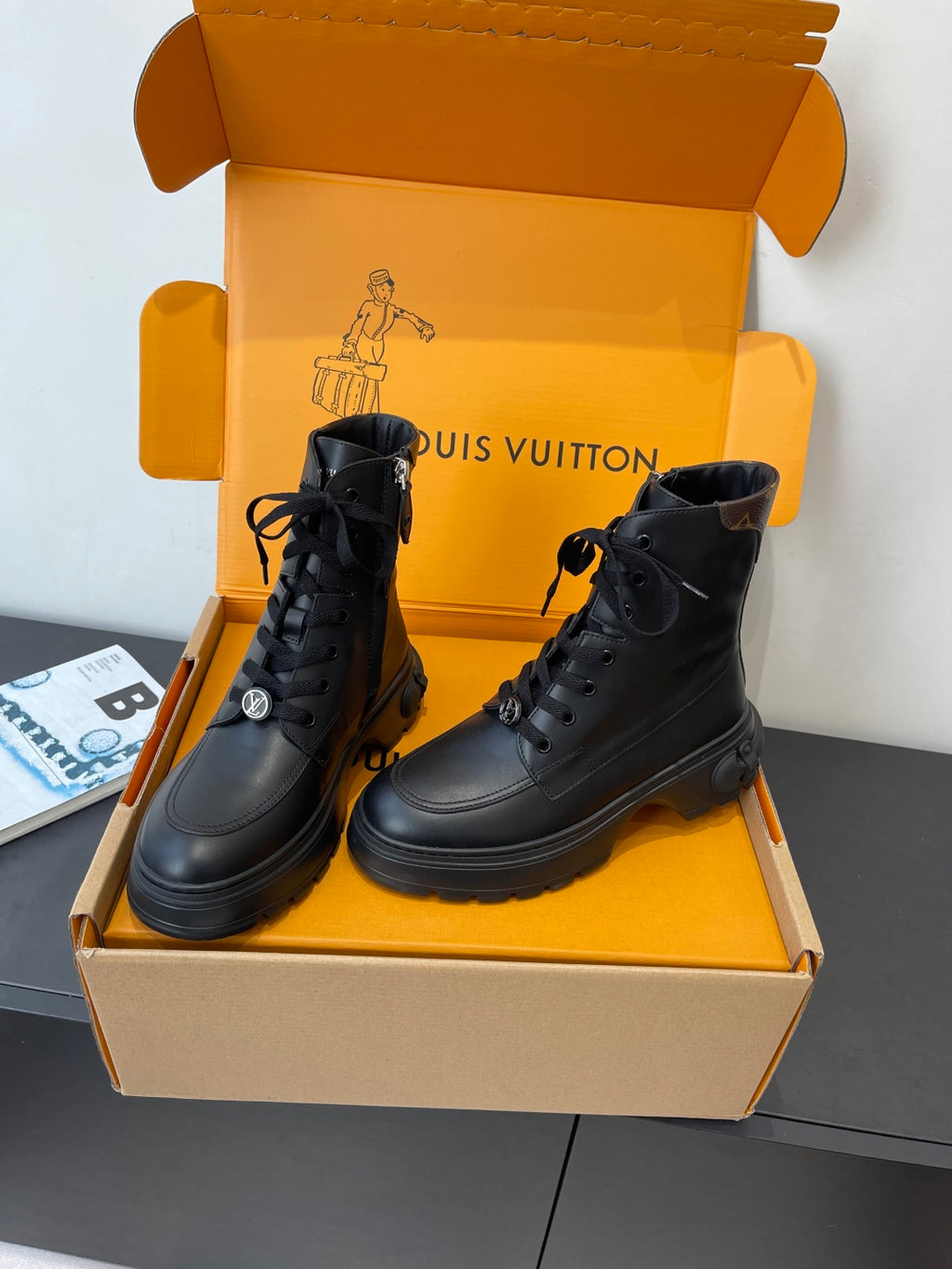 Louis Vuitton unisex black leather lace-up ankle boots with padded collar and thick tread