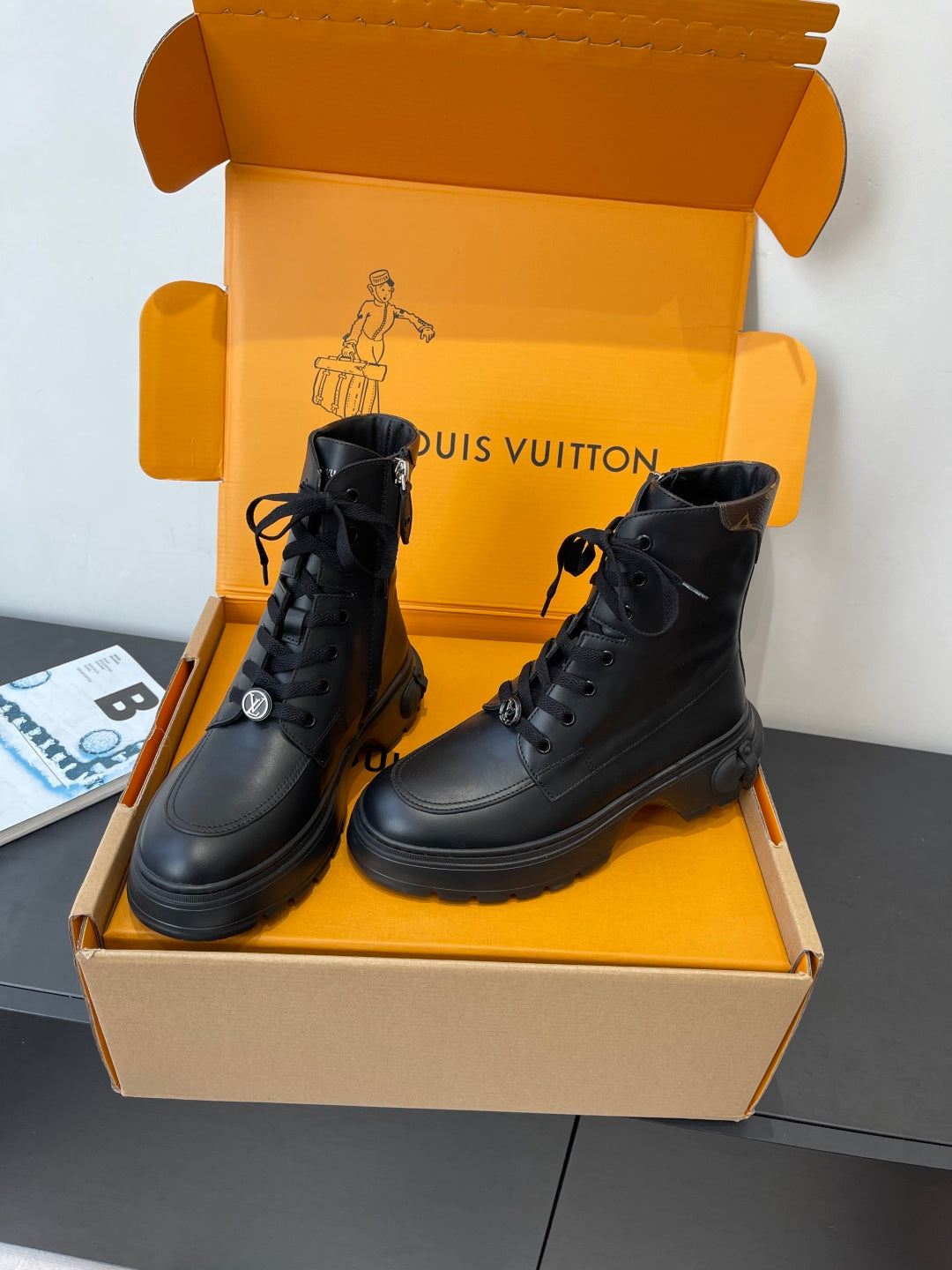 Louis Vuitton unisex black leather lace-up ankle boots with padded collar and thick tread