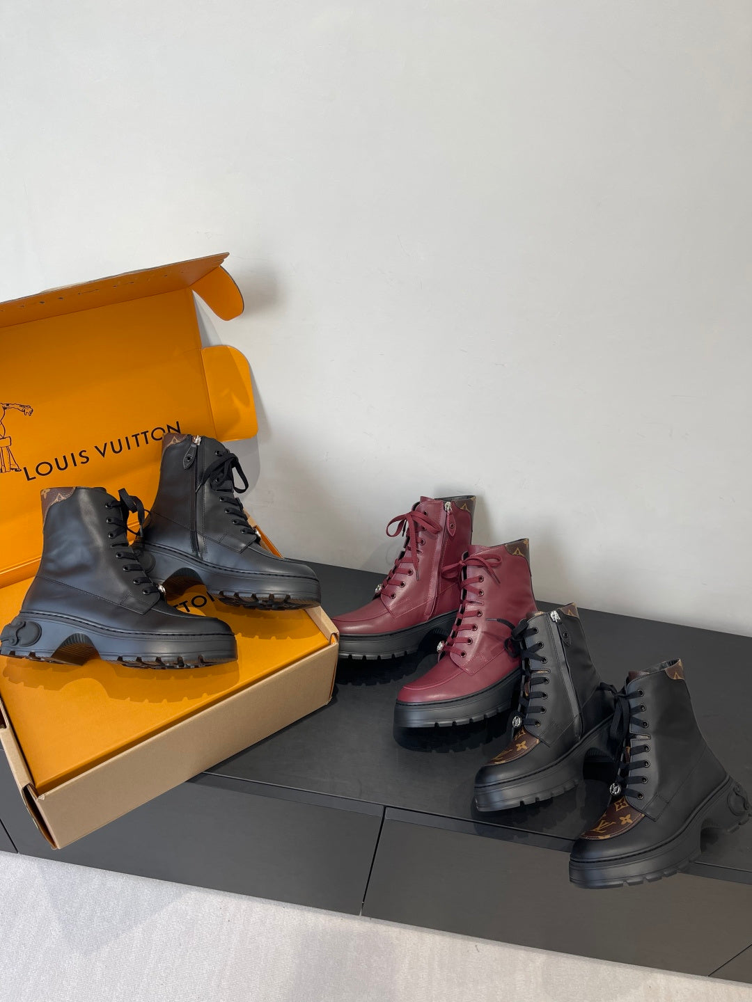 Louis Vuitton unisex lace-up ankle boots, black and burgundy styles in open box