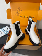 Louis Vuitton white chelsea boots with black elastic panels and chunky lug soles