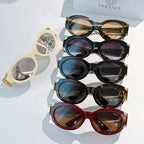 Assorted sunglasses set with cream, black, blue, orange, and red frames with tinted lenses