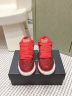 Red glitter lace-up sneakers with white sole and Amiri logo, on box