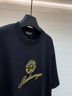 Dark short-sleeve T-shirt with gold Balenciaga crest and signature script
